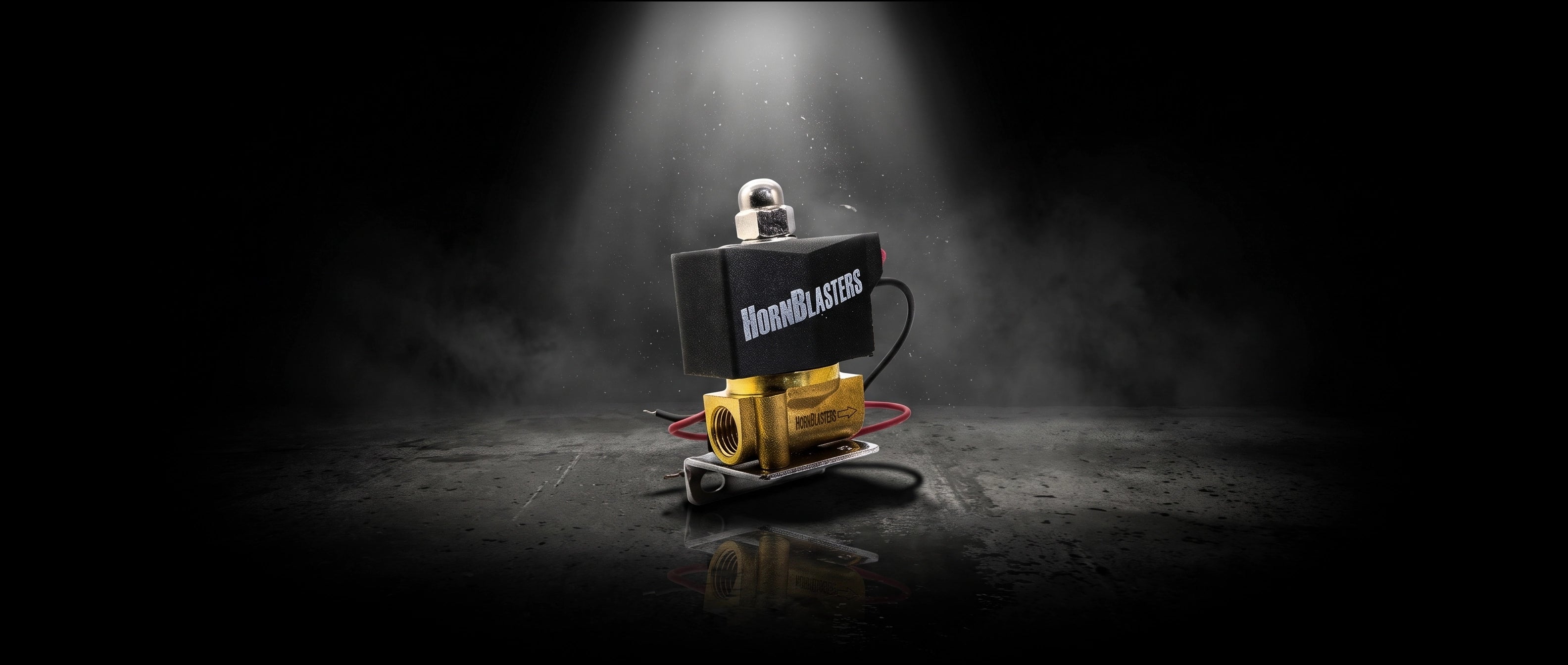 HornBlasters Brass 1/4" 110 Volt Electric Air Valve in dramatic cinematic light